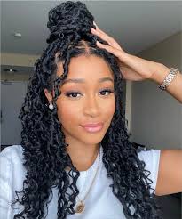 Woman rocking versatile knotless braids styled for a formal occasion