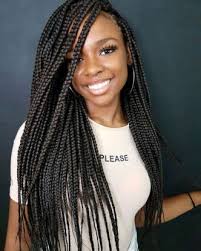 Stylish woman rocking trendy braids in Dallas, 2025